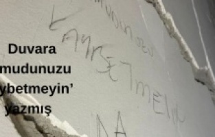 Enkazda kurtarılmayı beklerken duvara ‘Umudunuzu kaybetmeyin’ yazmış